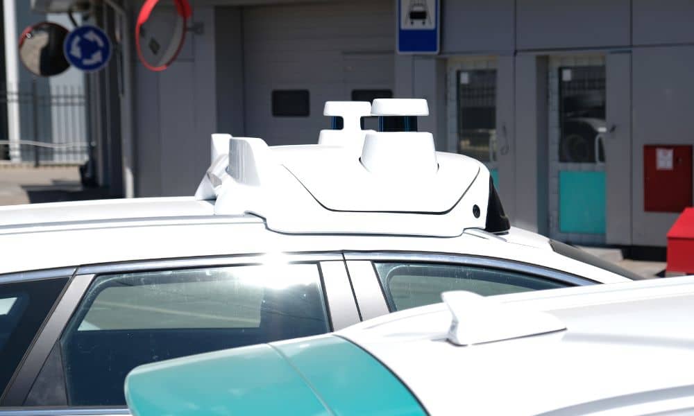 A self-driving robotaxi with roof sensors, highlighting why lidar mapping matters for accurate planning