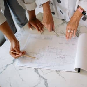 Residential site plan review documents - ALTA SURVEY Orlando Professionals reviewing detailed site plans that help buyers understand boundaries during a property survey