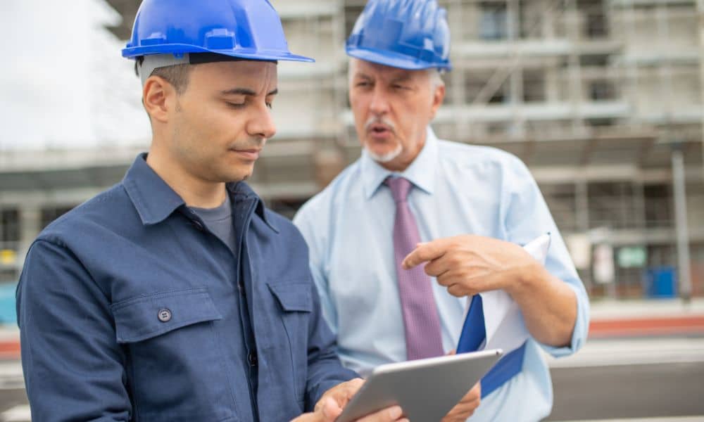 Developers reviewing plans and site details before ordering an alta survey for a new development project